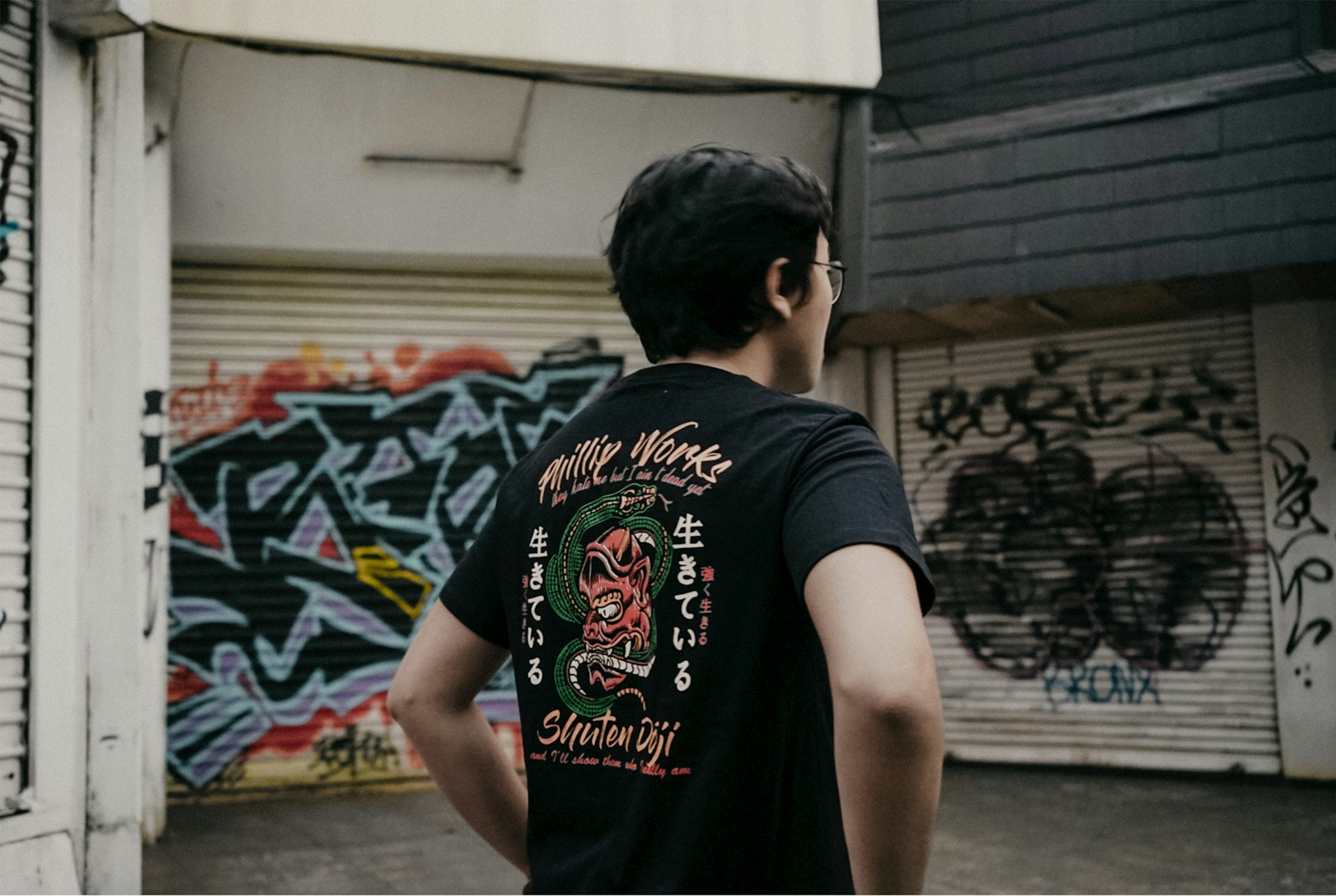 man standing outside roll-up foors